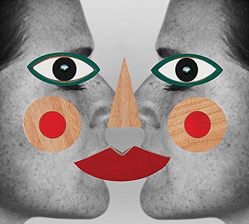 Abstract face with wooden and red shapes over grayscale lips and eyes.