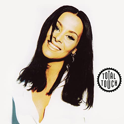 Album cover featuring a smiling woman with long dark hair and logo.