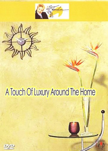 DVD cover featuring a sunburst clock, flowers, and a glass table.