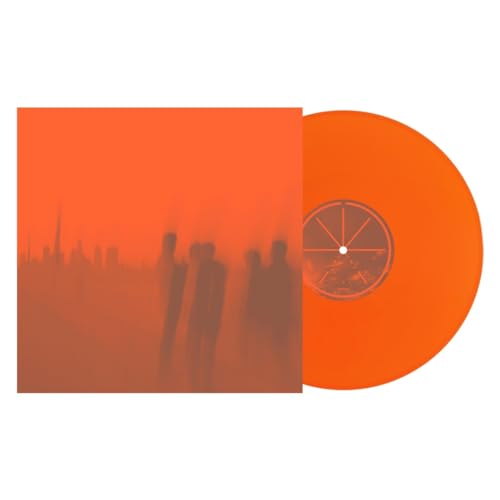 Orange vinyl record with blurred figures and a cityscape album cover.
