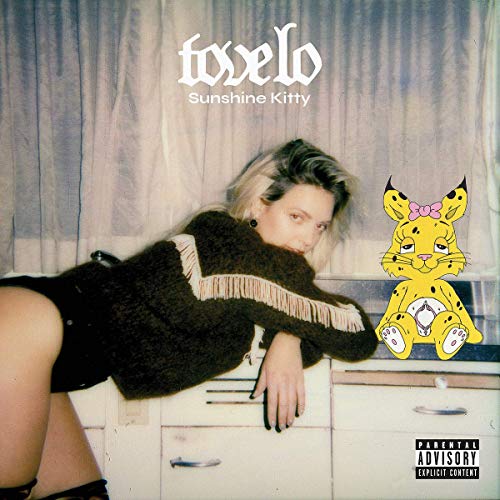Tove Lo album cover featuring a woman and cartoon yellow lynx.