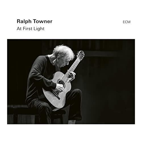 Ralph Towner playing acoustic guitar, album cover for "At First Light.