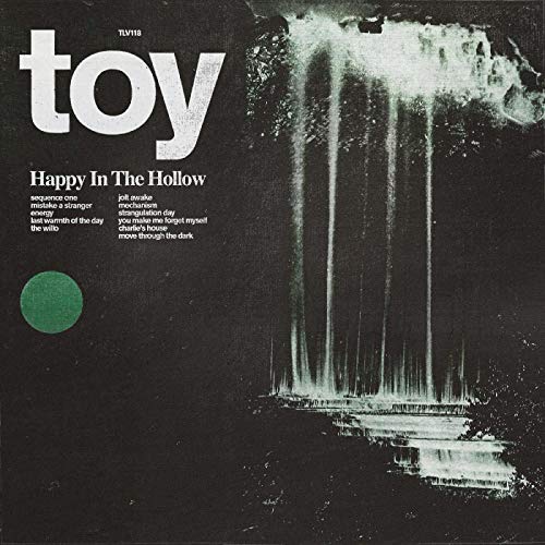 CD cover for Toy’s “Happy In The Hollow” with a blurred waterfall image.