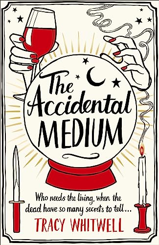 Book cover: crystal ball, hands, candle, knife, and title "The Accidental Medium".