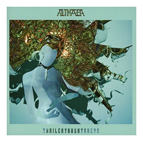 The image depicts a vinyl album cover with a stylized, abstract illustration. For accessibility purposes, a suitable alt text could be: "Vinyl album cover with abstract illustration of a person and gold foliage."