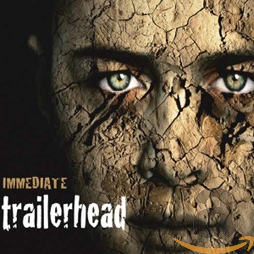 Close-up of cracked face with intense eyes, album cover for Trailerhead.