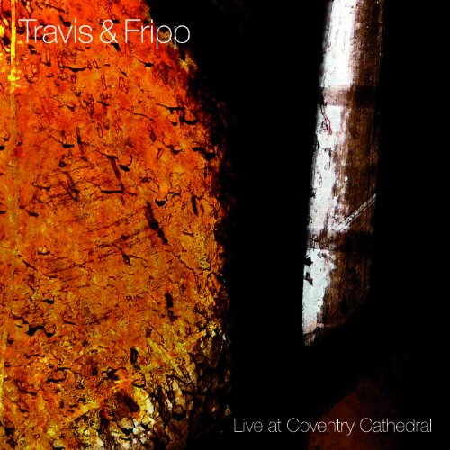 Album cover with orange textured surface and a vertical white pillar against black background.