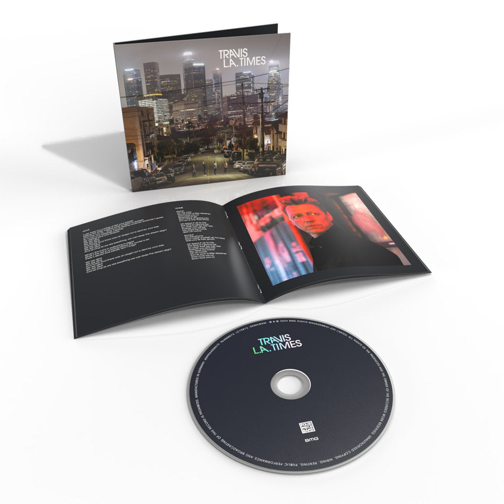 Travis “L.A. Times” CD case open with disc, showing cityscape and portrait.