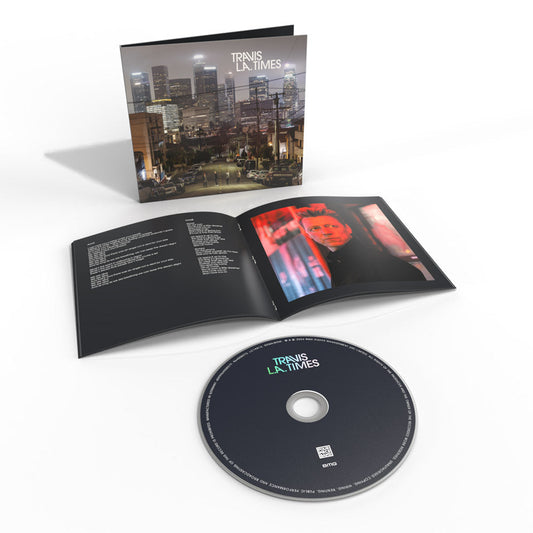 Travis “L.A. Times” CD case open with disc, showing cityscape and portrait.