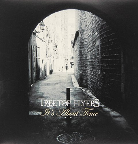 Black and white vinyl album cover with a dark alleyway and white text.