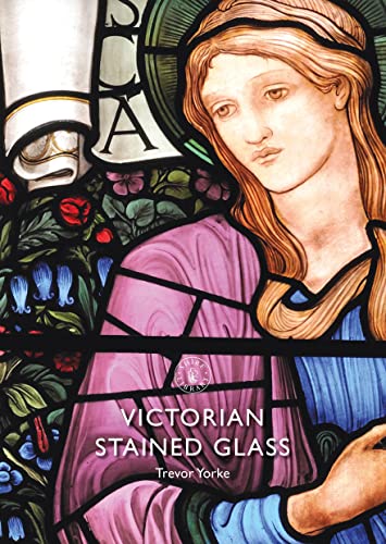 Close-up of a Victorian stained glass window depicting a woman’s face.