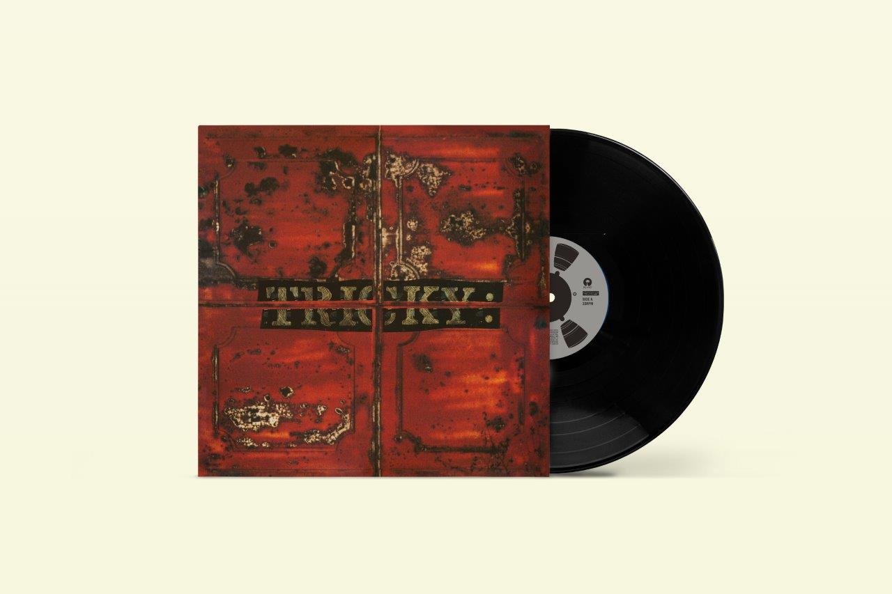 Vinyl record of Tricky’s “Maxinquaye” with a textured, rusty orange cover.