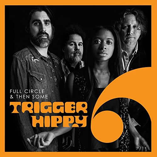 Black and white portrait of Trigger Hippy band with orange graphic.