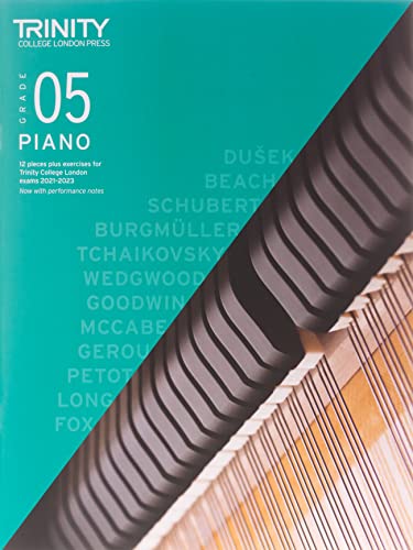 Trinity College London Grade 5 Piano Exam Pieces book with piano keys.