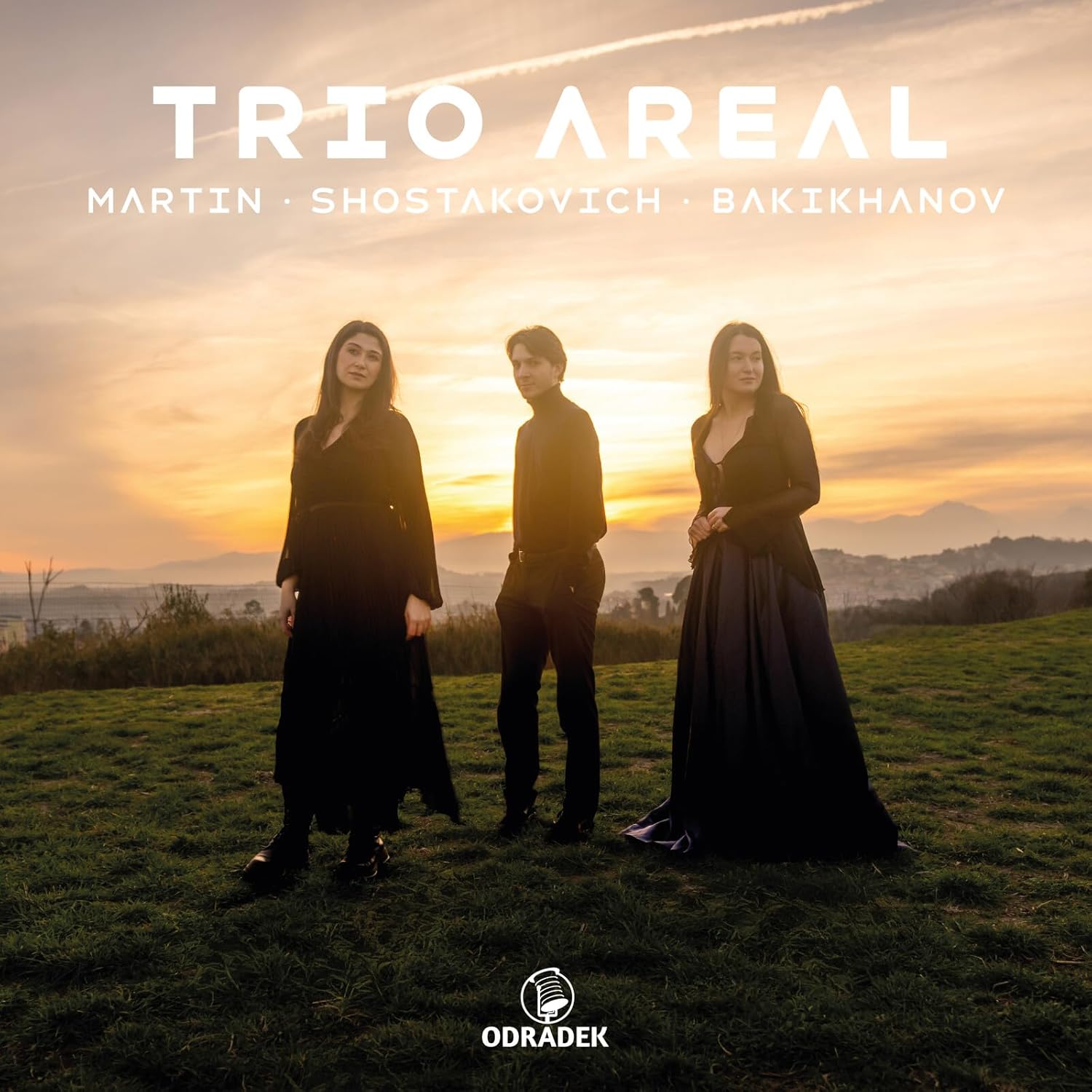 CD cover: Trio Areal musicians silhouetted against a sunset landscape.