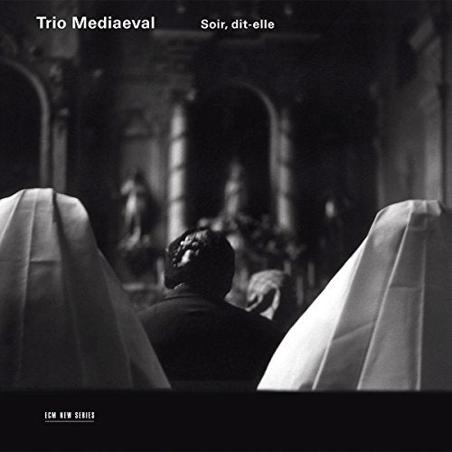 Black and white CD cover with a man between two draped figures.