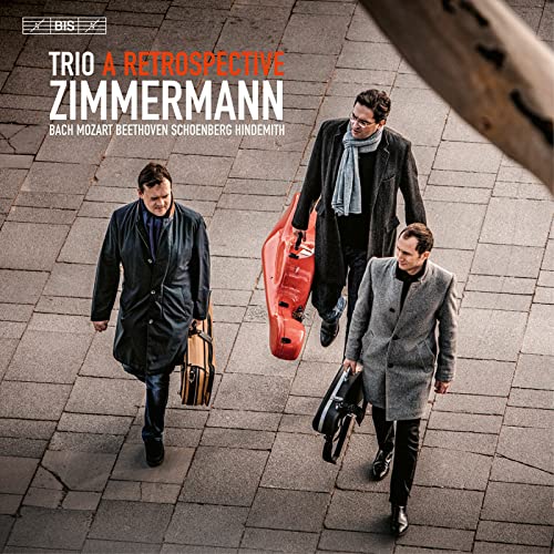 CD cover featuring three musicians walking with instruments on pavement.