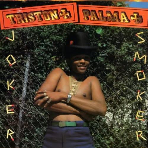 Album cover: shirtless man with hat and sunglasses against foliage.