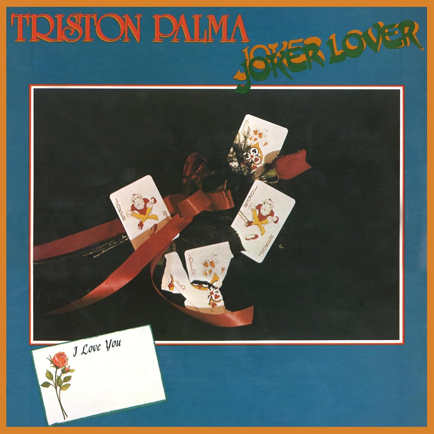 Vinyl record cover with playing cards, a bow, and a love letter.