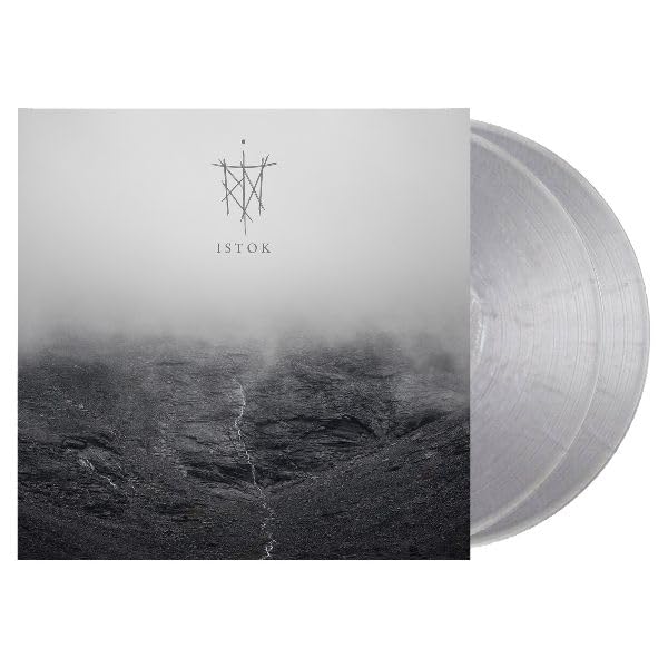 Album cover showing a rocky landscape in fog with two transparent metallic vinyl discs.