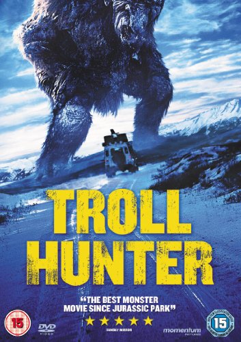 A giant troll looms over a vehicle on a snowy road on this DVD cover.