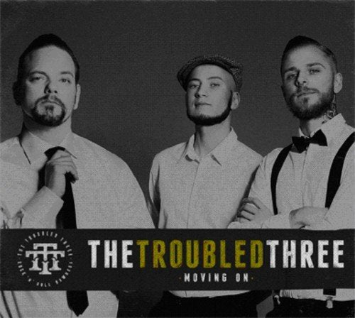 Black and white photo of three men in suits, album cover.