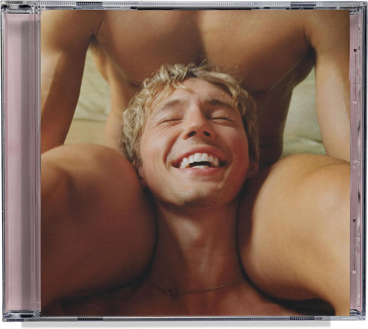 "Clear CD case with a sensual image of a man laughing, surrounded by others."