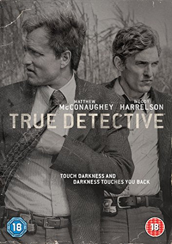 "True Detective" DVD cover featuring two men in suits with a dark, wooded background.