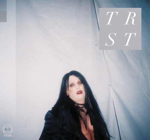 Vinyl album cover for “Trust” featuring a person with dark hair.