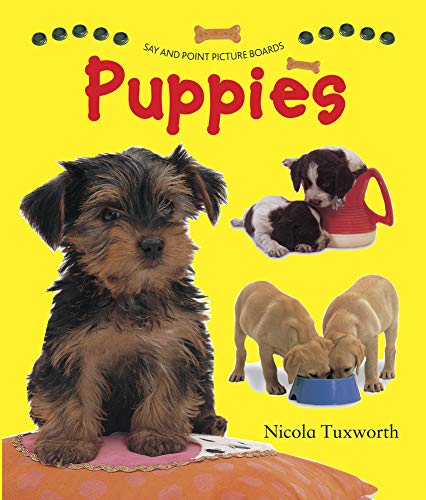 Book cover with photos of several small, fluffy puppies.