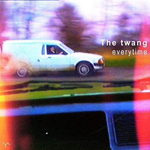 A vinyl record cover featuring a blurry white van on a road.