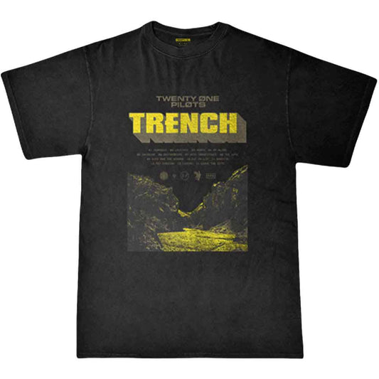 A man wearing a black Twenty One Pilots Trench t-shirt with a yellow graphic.