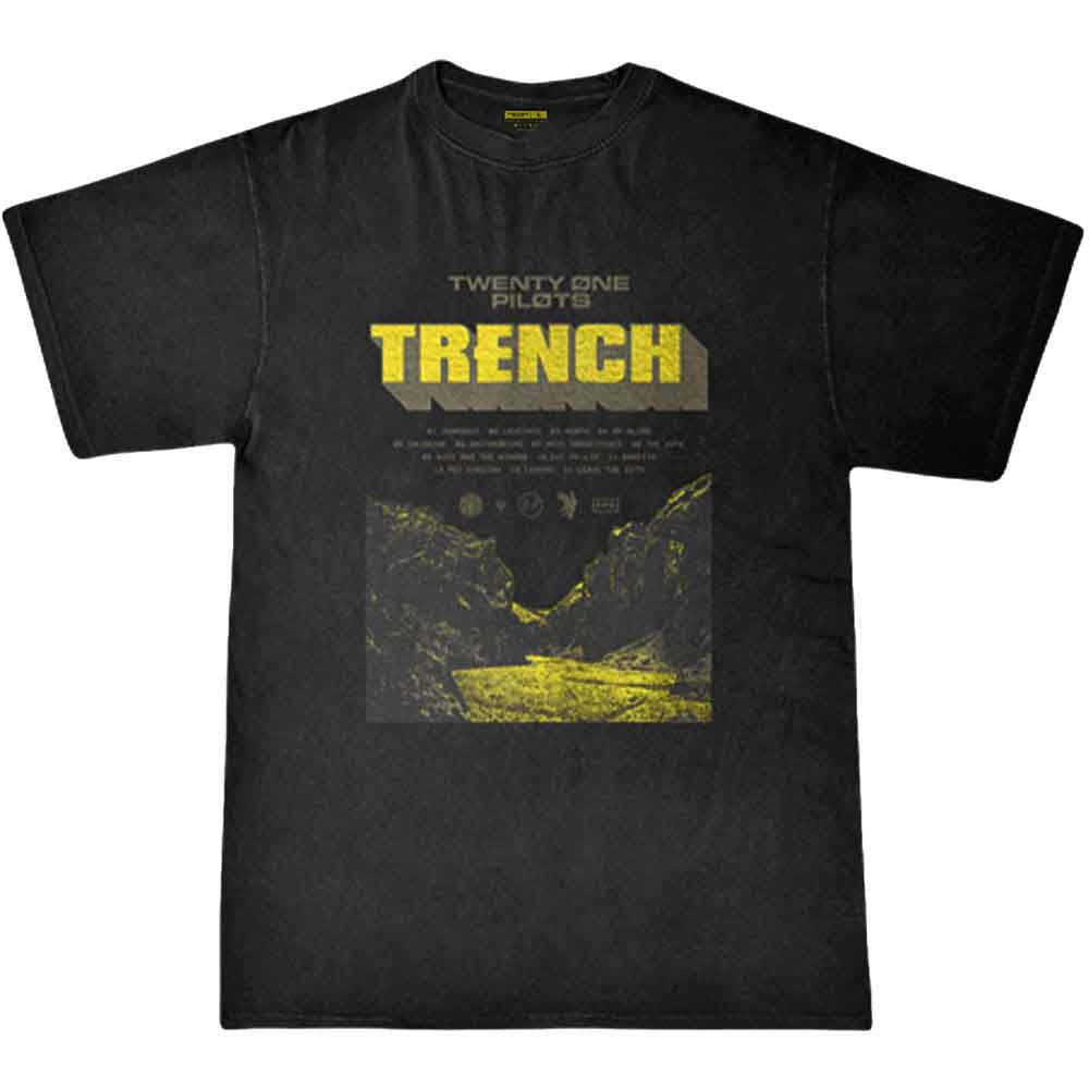 A man wearing a black Twenty One Pilots Trench t-shirt with a yellow graphic.