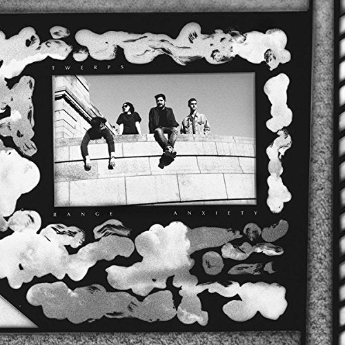 Black and white vinyl record cover with a band on a rooftop.