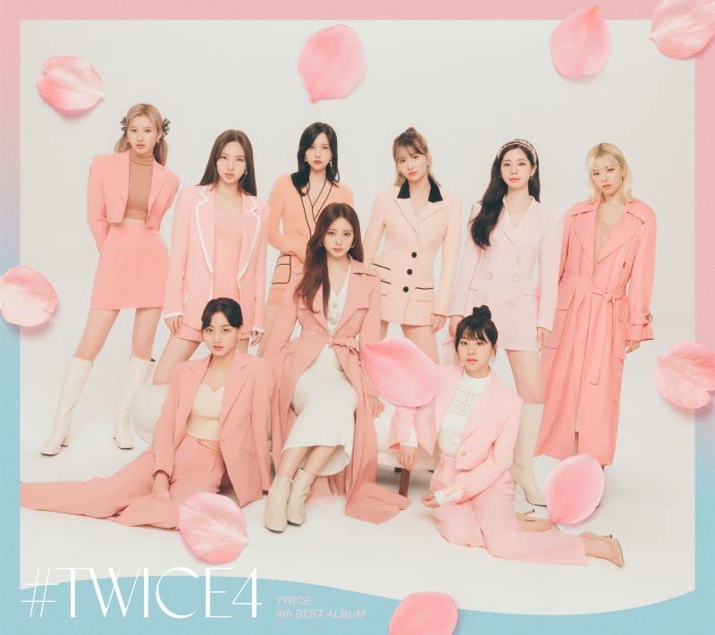 Nine women in pink suits pose against a pastel pink and blue background.