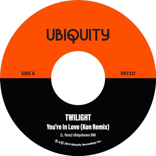 Vinyl record label with orange top and black bottom, featuring Ubiquity and track details.
