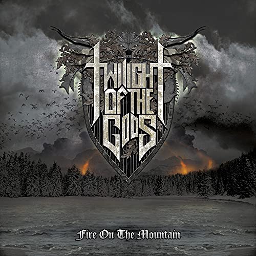 CD cover: shield with band name, mountains, fire, and birds in a dark sky.