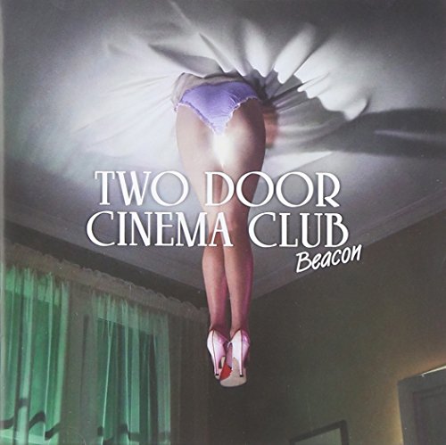 CD cover for Two Door Cinema Club’s “Beacon,” featuring a figure and curtains.