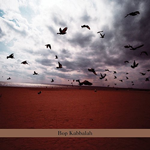 "Album cover with birds flying over a beach, titled 'Bop Kabbalah' on a brown banner."