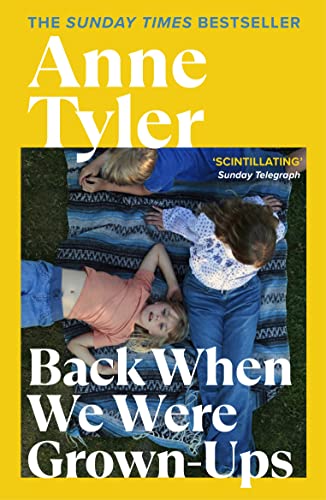 Book cover featuring three children lying on a blue patterned blanket on grass.