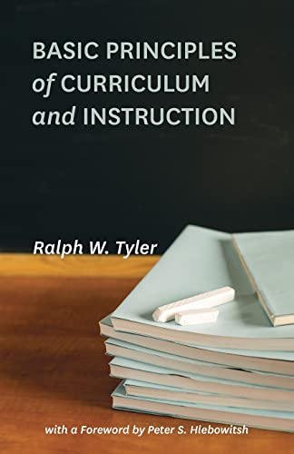 Book cover with white text on a blackboard background and stacked notebooks with chalk.