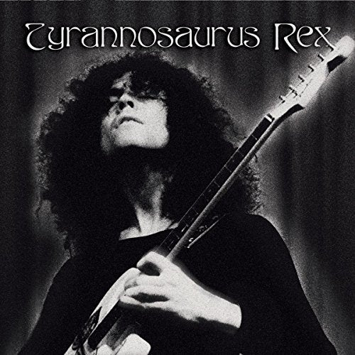 Black and white album cover featuring a musician with long hair and a guitar.