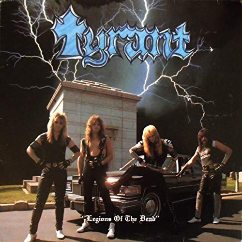 "Album cover featuring four men in black attire standing near a car under stormy sky."