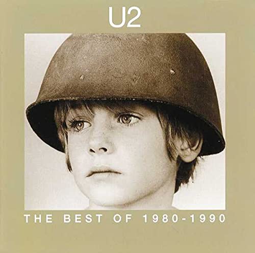 Album cover featuring a child wearing a military helmet with U2 text above.