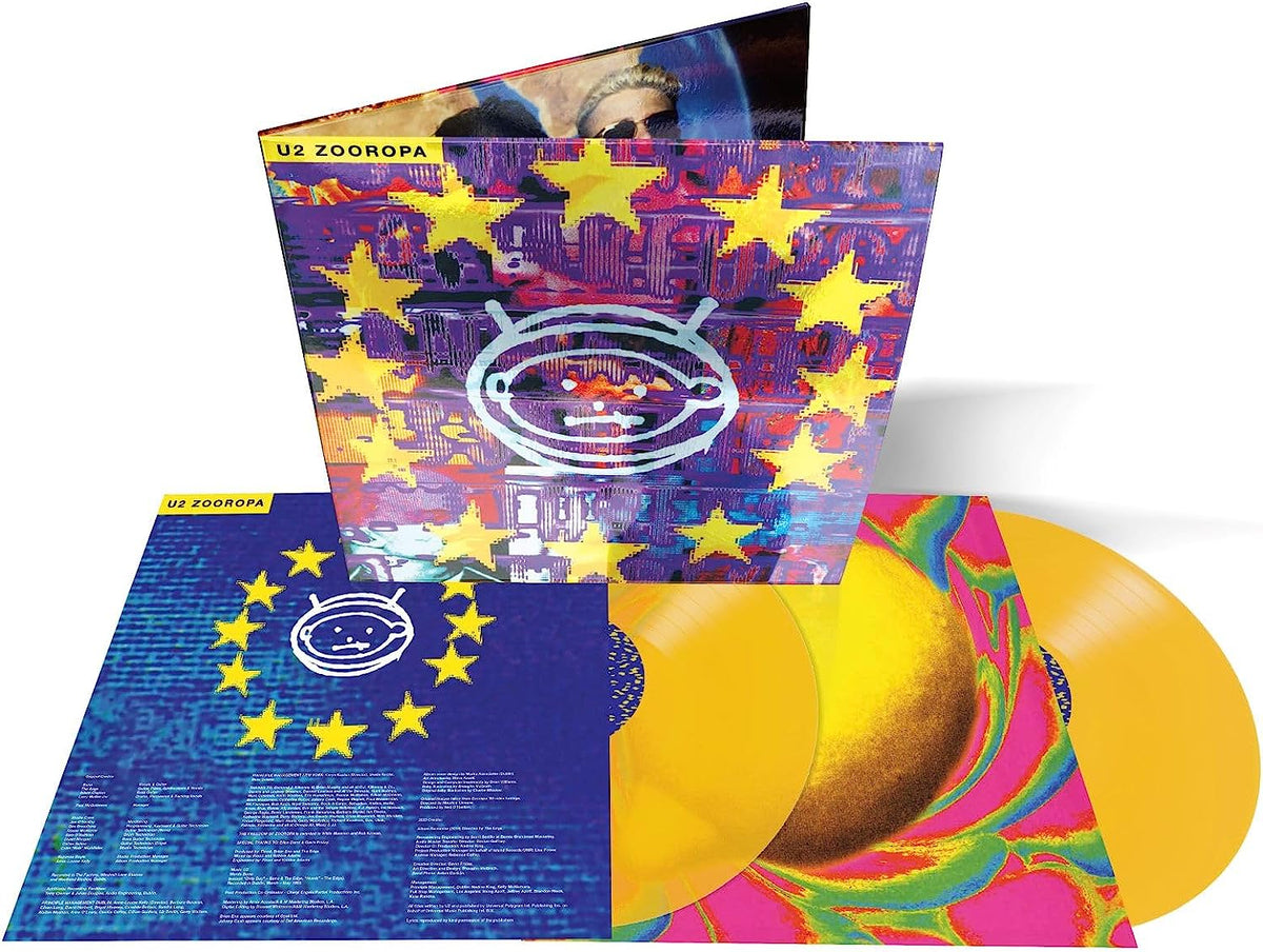 "U2 Zooropa vinyl record with yellow discs and colorful sleeve artwork."