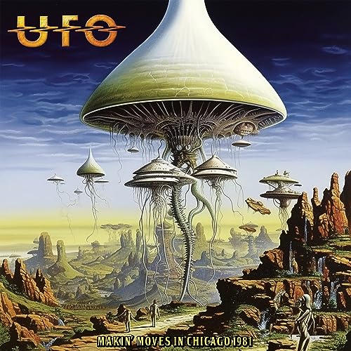 UFO album cover: a large, detailed spaceship over a rocky landscape.