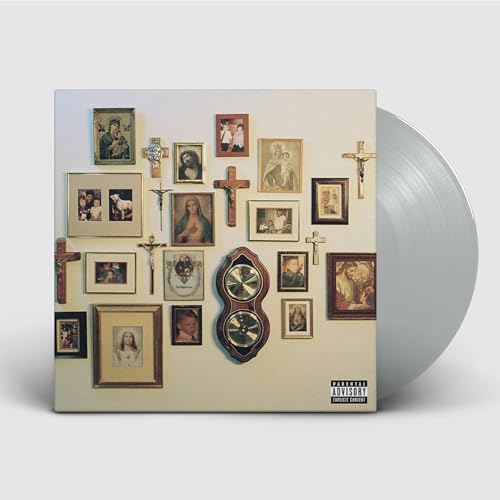 Vinyl record with album cover displaying framed portraits and religious icons.
