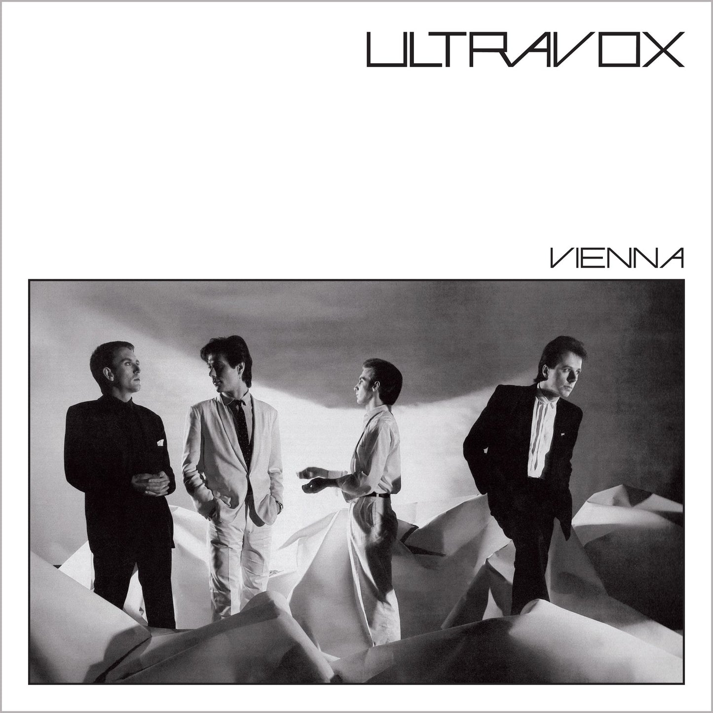 Ultravox album cover, "Vienna," featuring four men in suits, grayscale.