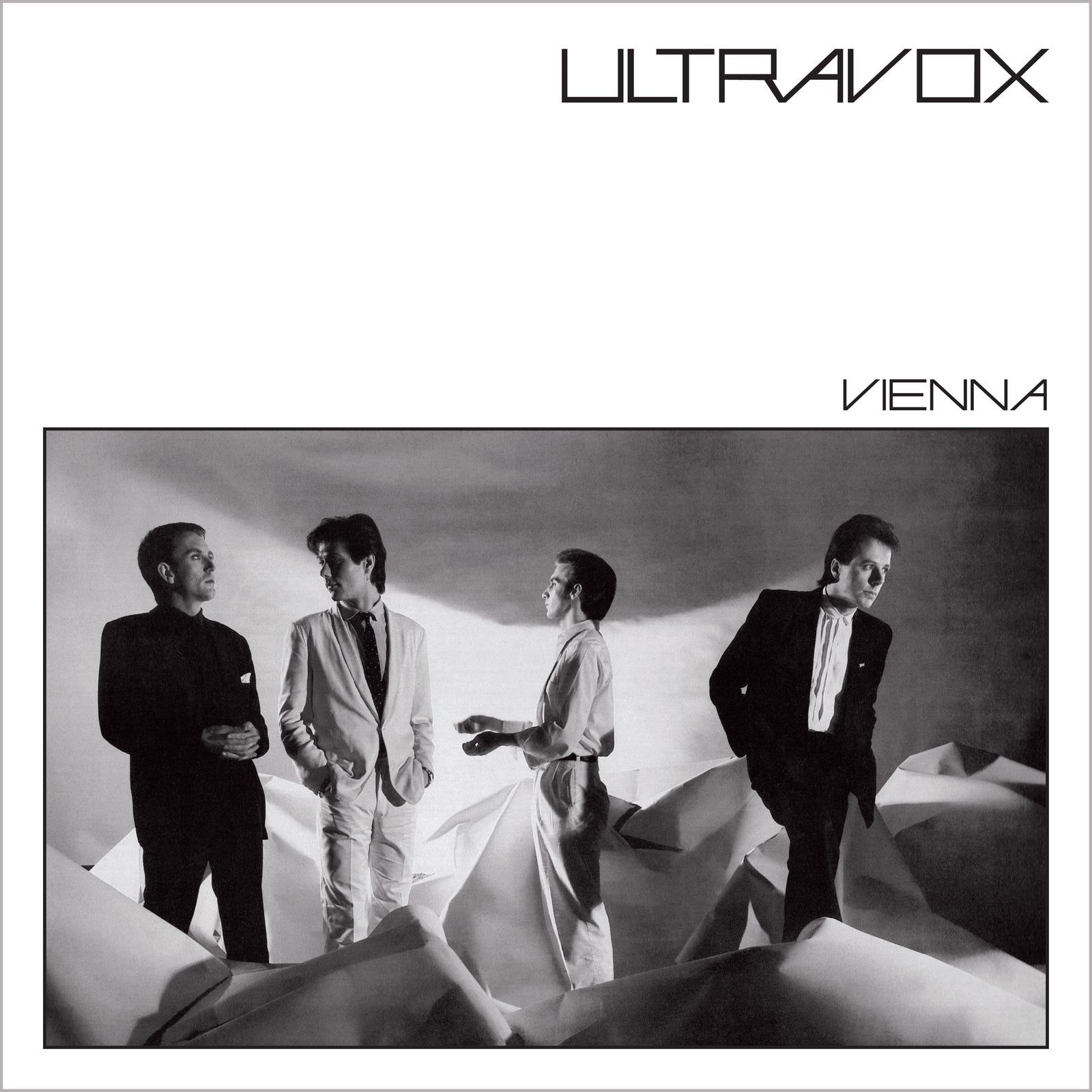 Ultravox album cover, "Vienna," featuring four men in suits, grayscale.