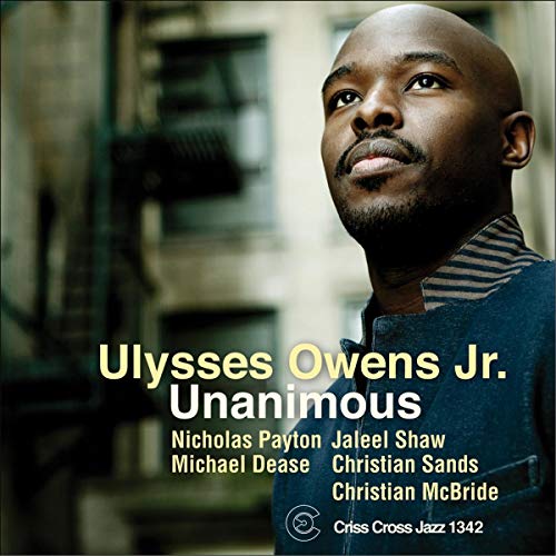 CD cover featuring Ulysses Owens Jr., a Black drummer looking upwards.
